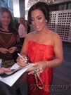 Claudia Ferri signing proof